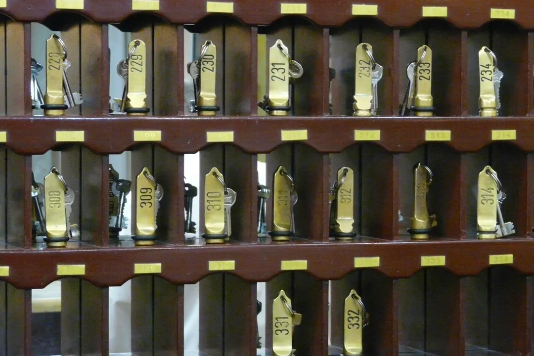 Wall of numbered hotel room keys, chargeback prevention for hotels