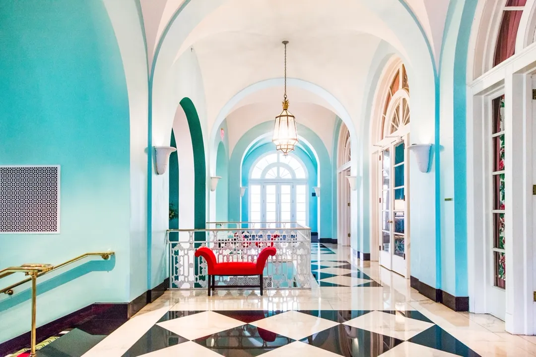 Arched resort hotel hallway, payment processing for hotels, resorts, and rentals
